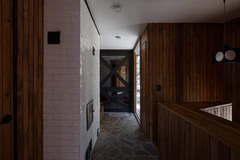 Brick and stone are featured in the interiors, too, to make the cabin feel like cabin