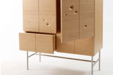 05 The cabinet of red oak and stainless steel is a unique storage piece