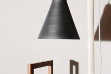 05 The floor or table lamp from the collection features raw and minimalist easthetic