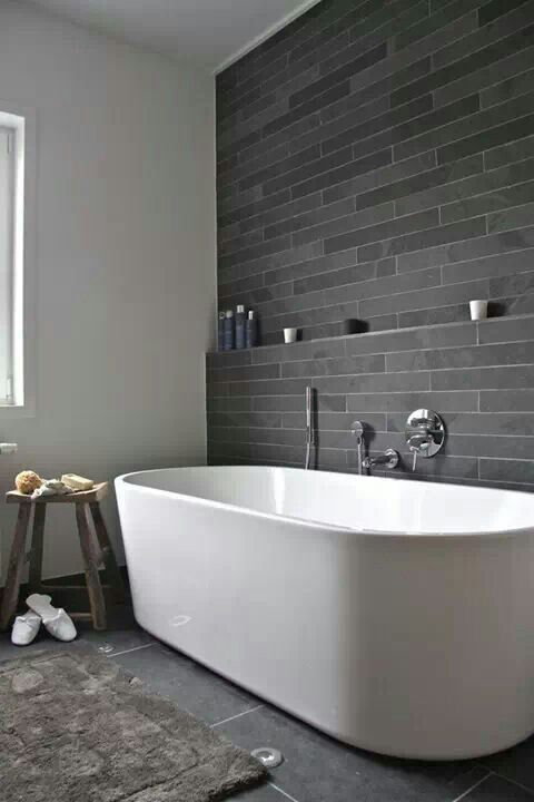 same grey stone tiles - longer and narrow ones on the walls and large ones on the floor