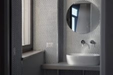 contemporary bathroom design with cool penny tiles