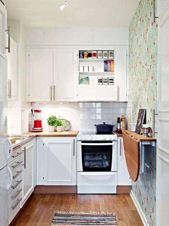 a tiny kitchen with a wall-mounted dining table is a great idea to save some floor space
