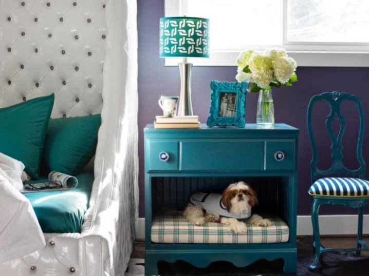 a vintage dresser and bedside table with a dog space added in the lower part of it