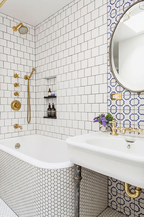 neutral tiles - square ones and penny hex tiles plus an accent with blue and white mosaic tiles over the sink