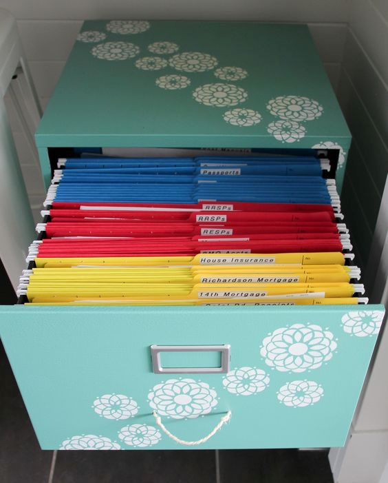 organizing paperwork with a colour coded file system will help you tackle paper clutter
