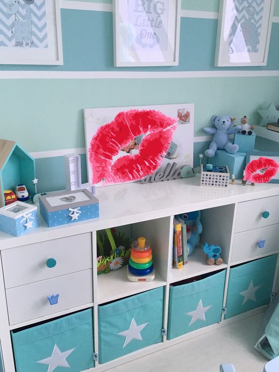 a Kallax shelf with turquoise Drona boxes with stars for a boy's room