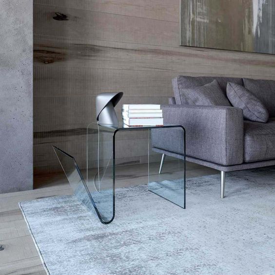 such a curved glass table will add a sophisticated yet modernized feel to the space
