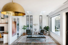 09 Some spaces feature mid-century modern furniture as inspiration from the origins of the house