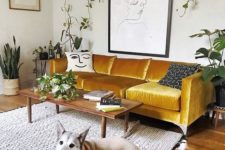 09 a bold mustard velvet sofa is the centerpiece of the living room, with its color and material