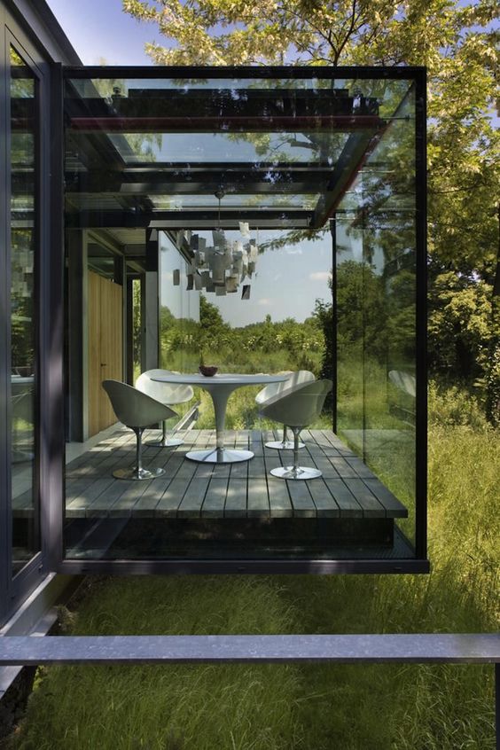 a smoked glass sunroom will keep more privacy and keep you away from the excessive sunlight