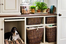 10 a laundry storage cabinet with a built-in dog bed so that your dog could keep your company while you are doing things