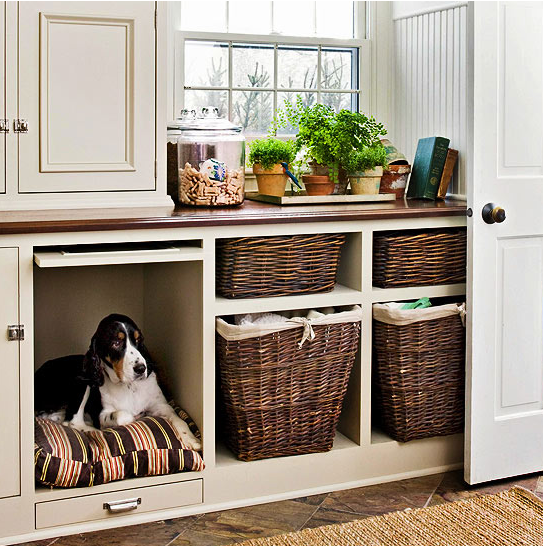 a laundry storage cabinet with a built-in dog bed so that your dog could keep your company while you are doing things