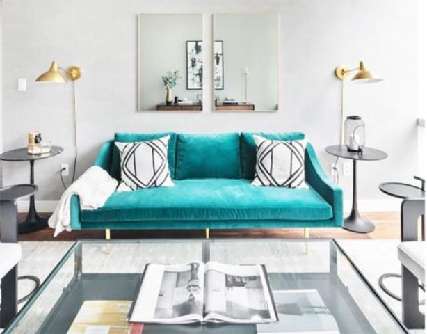 a turquoise suede sofa makes a colorful statement and a bold accent in the living room