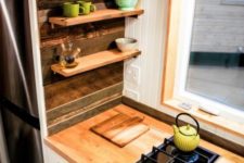 10 tiny floating shelves over the cabinets are amazing for storage and don’t look bulky at all
