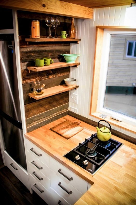 tiny floating shelves over the cabinets are amazing for storage and don't look bulky at all