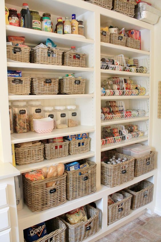 a perfectly organized pantry with baskets and jars and chalkboard labels for a stylish look
