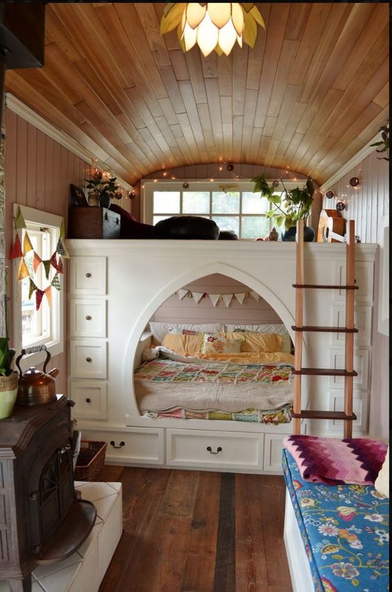 A smart built in bed with additional storage drawers on each side is a cool way to go