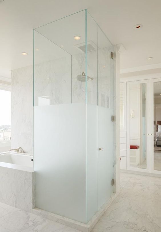 a half frosted glass shower next to the bathtub is a gorgeous contemporary bathroom decor idea
