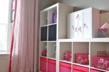 12 a kids’ storage unit made of Expedit and of colorful Drona boxes with a pompom trim