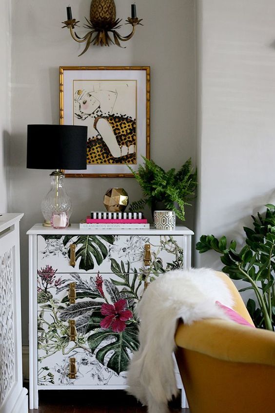 a sideboard upcycled with bright botanical and floral prints and leather pulls looks stunning