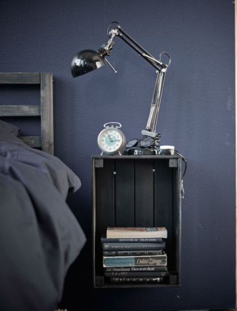 a Knagglig box painted grey and attached to the wall makes up a cool floating bedside table and saves floor space