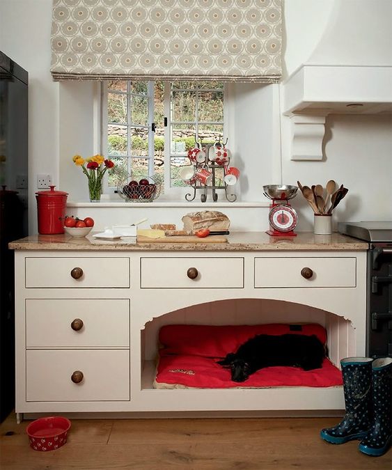 a kitchen cabinet with a bright and soft dog bed included to prevent your pet from disturbing you while cooking