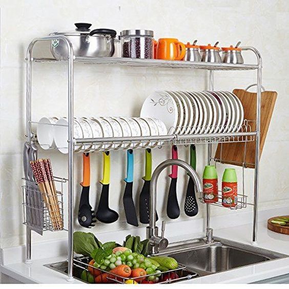 a stylish and comfy shelving unit over the sink with plates, mugs, pots and spoons is a smart idea