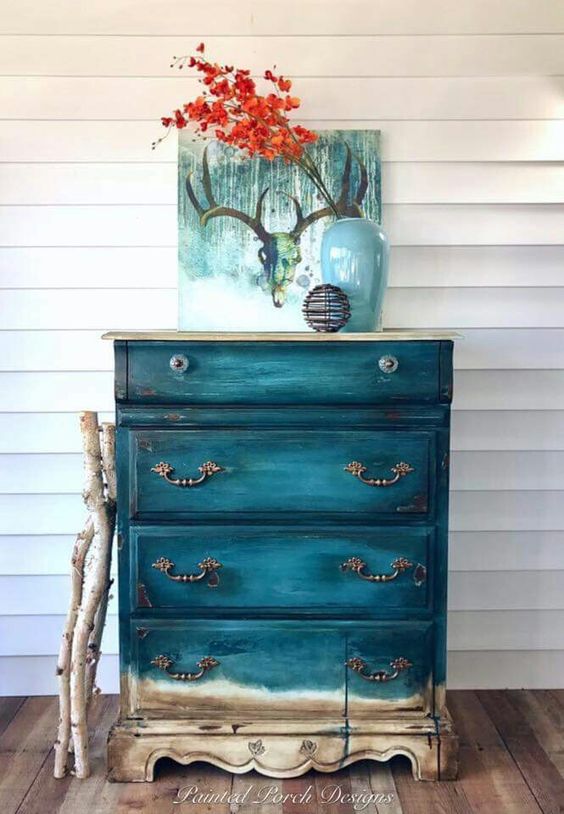 an old sideboard renovated with teal with a gradient effect is really worth crafting