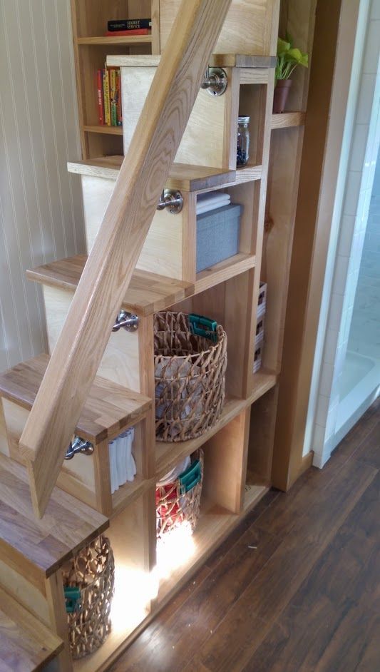 a ladder with incorporated storage features two functions at the same time