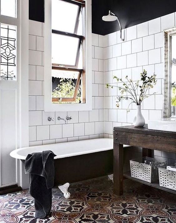 bold mosaic tiles with catchy patterns and white tiles on the walls that accent the floors even more