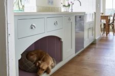 15 a kitchen cabinet with an integrated dog bed for him or her to stay by your side while you are cooking