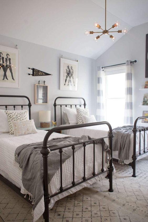 a neutral guest bedroom with two beds and touches of vintage here and there