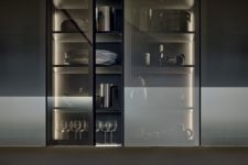 16 a kitchen cabinet with smoke glass doors shows off the glasses and dishes but does it gently