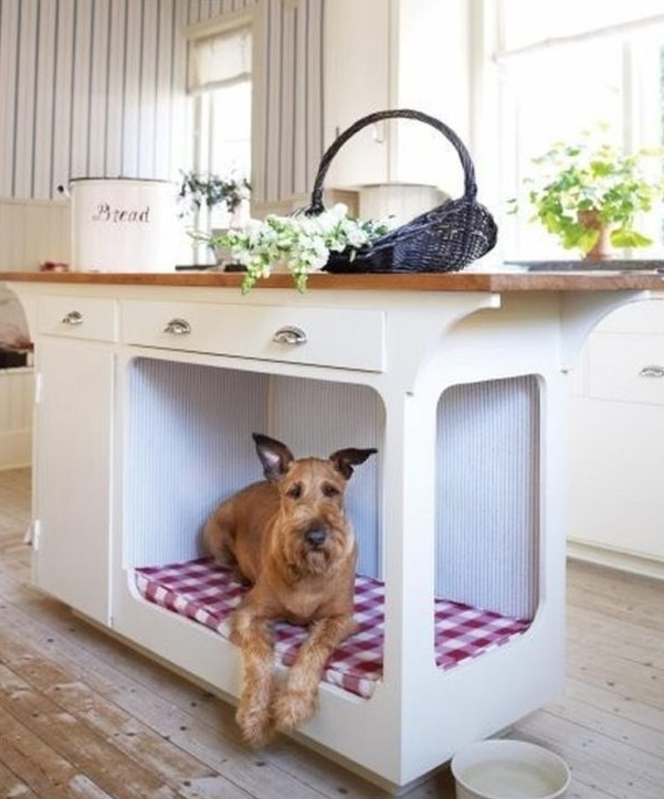 a kitchen island with a dog bed that is built-in is a cool way to let your pet be around without preventing you from cooking