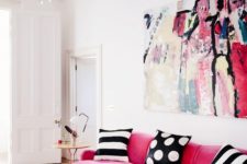 17 a pink velvet sofa makes a statement with texture and with bright color, black and white pillows create a contrast