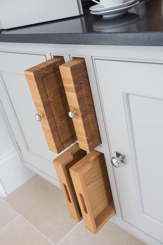store your cutting boards inside a cabinet making just some holes for them