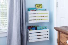 17 white Knagglig boxes attached to the wall make up cool toy and book storage easily