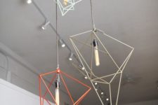 19 a bunch of geometric pendant lamps in various colors will make your space different