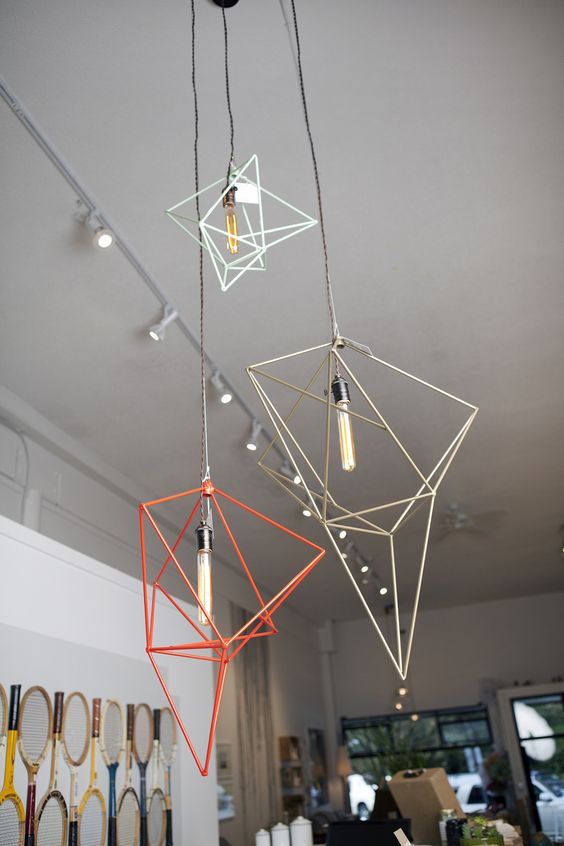 a bunch of geometric pendant lamps in various colors will make your space different
