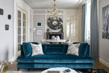 19 a medium blue velvet sofa brings color to the space yet keeping it calm and relaxing enough