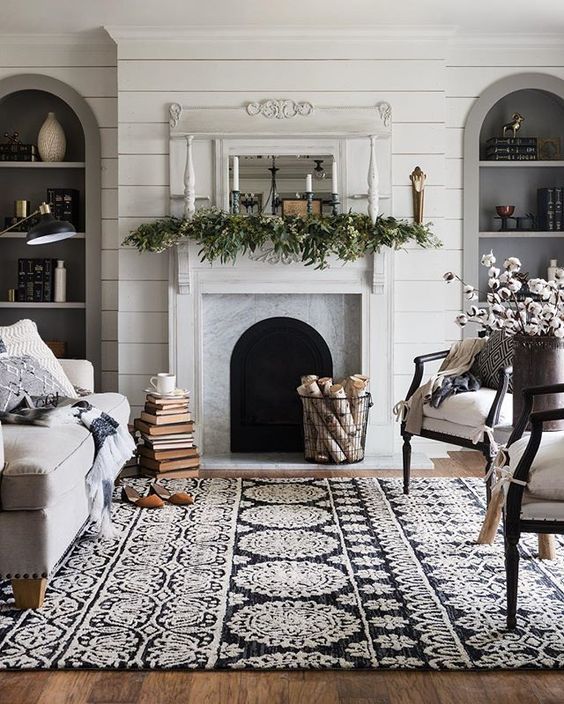 a black and white patterned rug completes the room and adds itnerest with texture and patterns