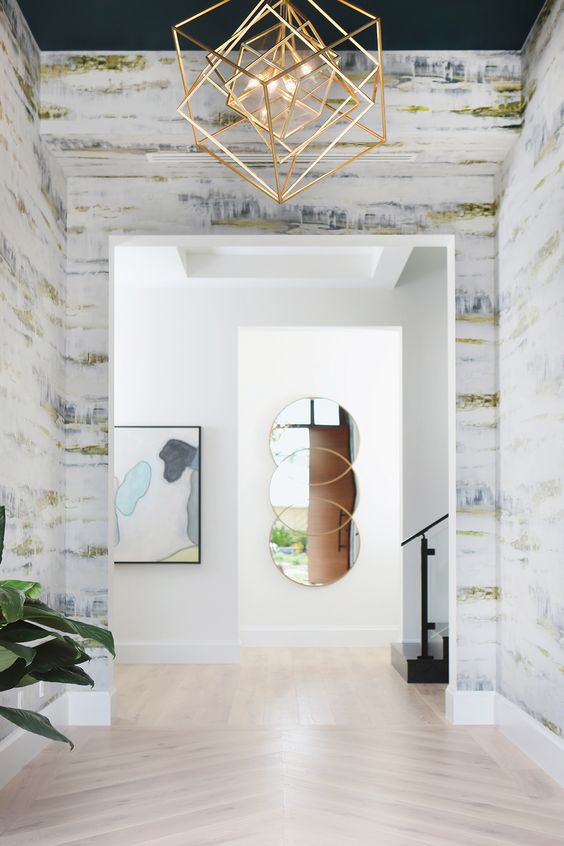 a fantastic brass cube chandelier changes the entryway at once and makes it bold