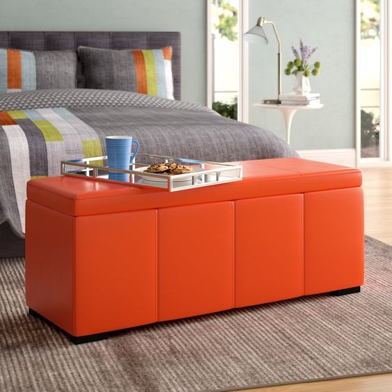 a stylish and modern bright ottoman with a storage space can be used in a bedroom, too