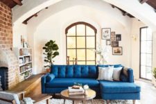 21 a bright blue L-shaped sofa adds color and interest to the space becoming its centerpiece