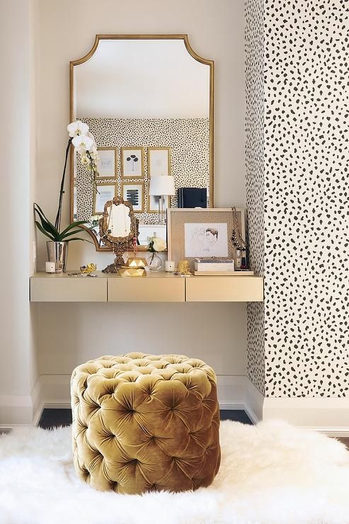 a refined makeup nook with a cool mustard velvet tufted pouf with storage inside