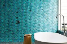 22 a bold turquoise fish scale tile wall is a statement in the bathroom, and neutral grey tiles on the floor