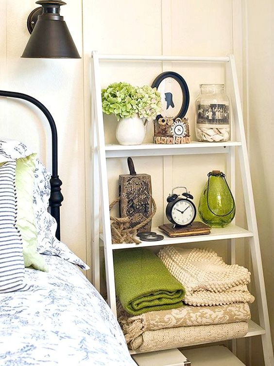 a ladder by your bed can easily substitute a usual bedside table and will take less space