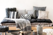 22 a tribal blanket and some tribal pillows bring in cool vibes making the space bolder