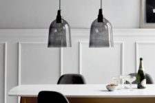 22 smoked glass pendant lamps over the dining table is bold and edgy idea to try