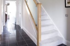 23 a frosted glass staircase looks very modern and bold and adds a touch of edge to your space